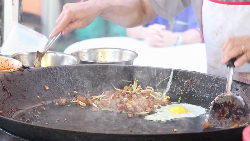 Street Hawker Vendor Stir Frying Radish Cake or Chai Tow Kueh with Dark Sweet Soy Sauce in Southeast Asia 1920x1080