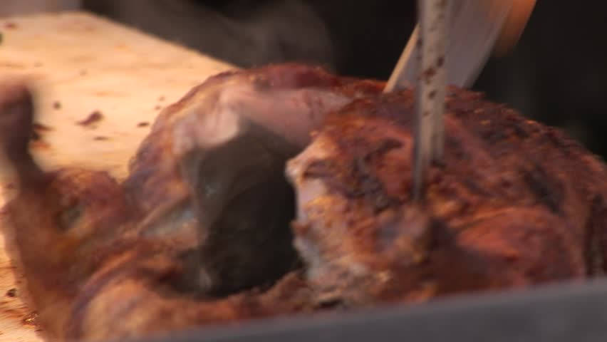 HD1080i Carving a Roasted Chicken on Oktoberfest. Munich beer festival.