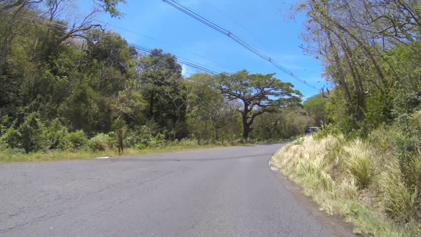 COSTA RICA - MAR 2013: Vehicle shot of driving through central Costa Rica along highway 142 in March, 2013.
