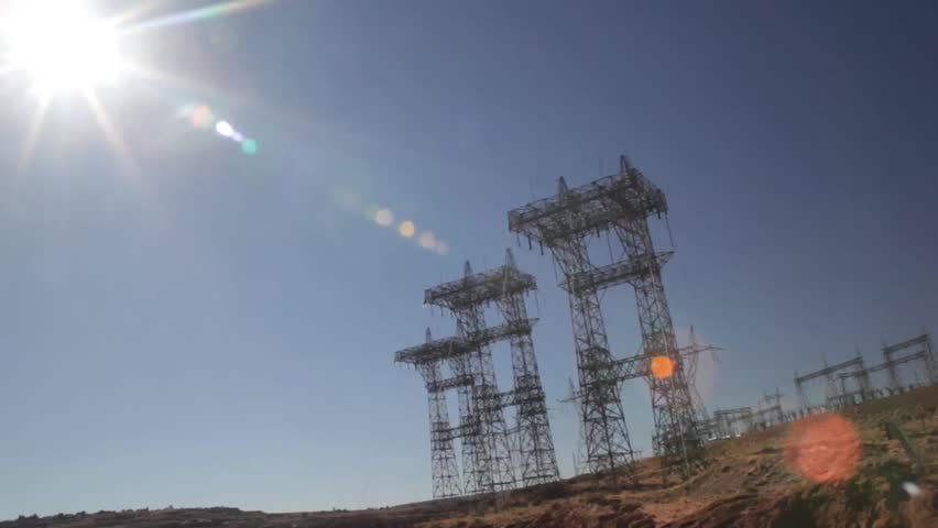 Tilt down shot from Power Lines with lens flair to the Colorado River below. Shot at the Glen Canyon Dam in Page, Arizona