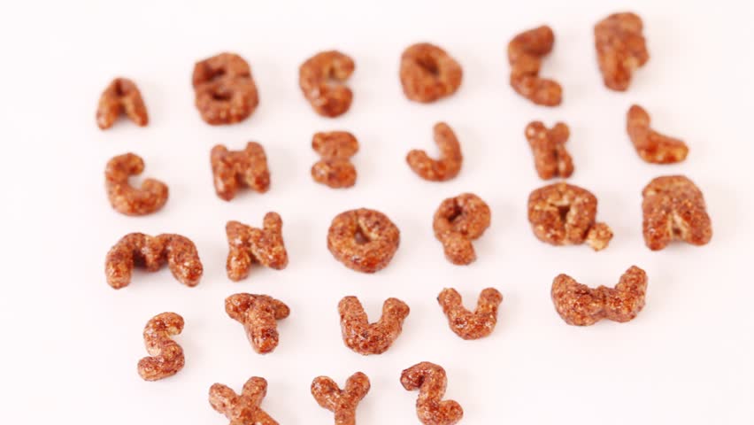 Alphabet letters from cereals on white background