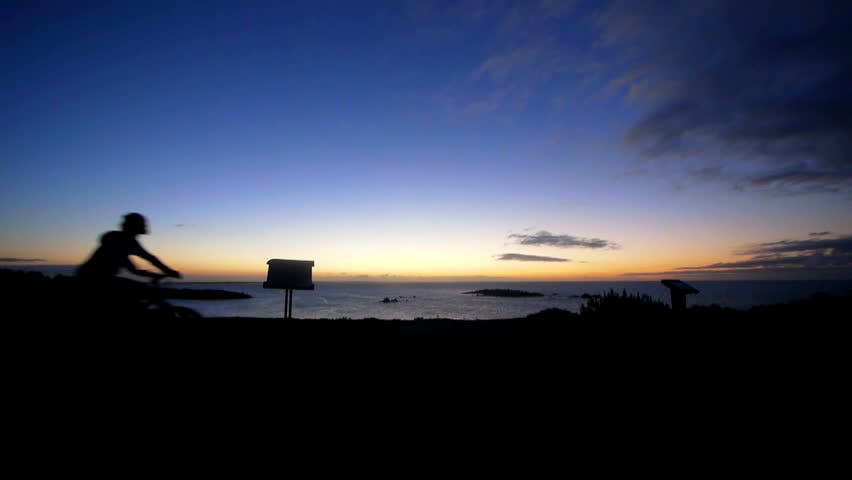 Sunrise on bikes over ocean