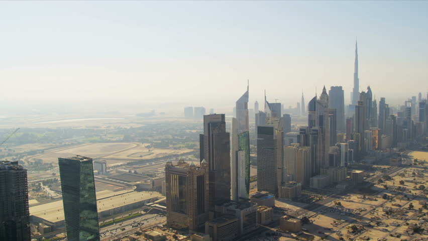 Aerial view of skyscrapers in cosmopolitan downtown Dubai, helicopter blades shadow line, UAE, RED EPIC