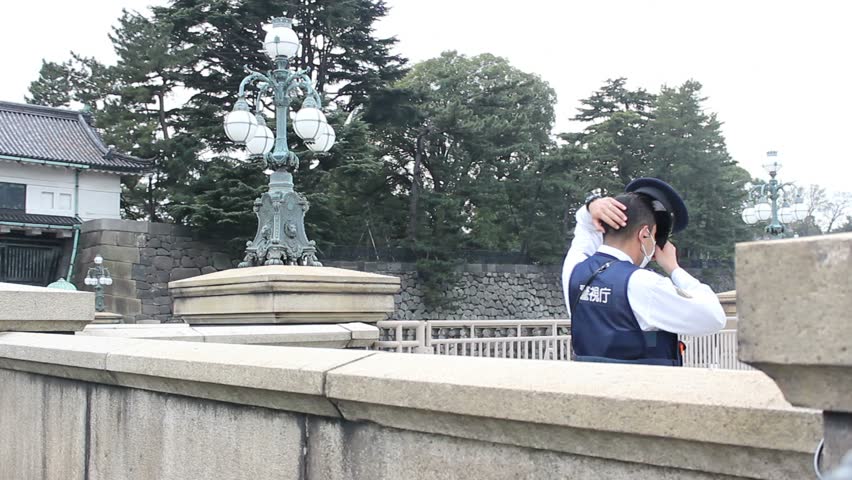 TOKYO - CIRCA MARCH 2013: Unidentified guard at the Emperor's palace.