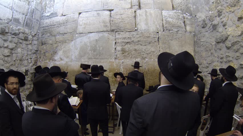 JERUSALEM, ISRAEL -  MARCH 27: Jews pray in the Western Wall in the night before the Priestly Blessing  (Hebrew - Birkat Cohanim) during the Passover Holiday, March 27 2013 in Jerusalem, Israel.