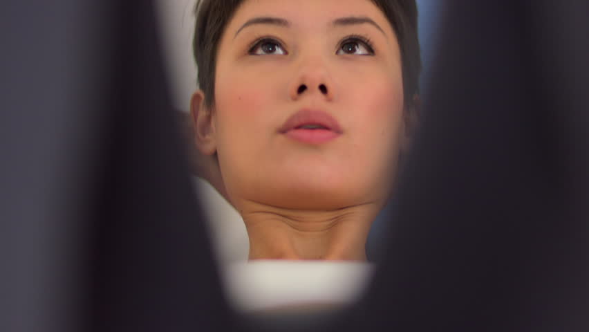 Closeup of Chinese woman doing crunches