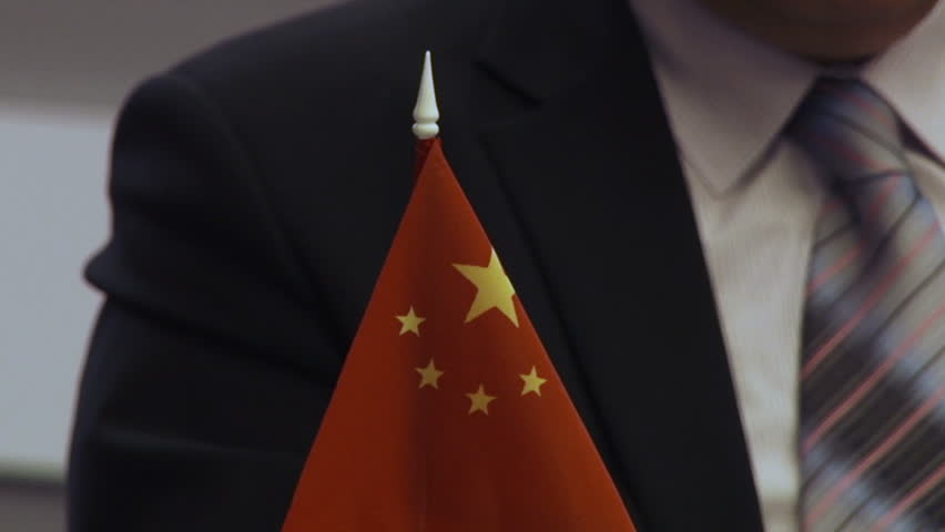 Chinese flag oppisite man's silhouette