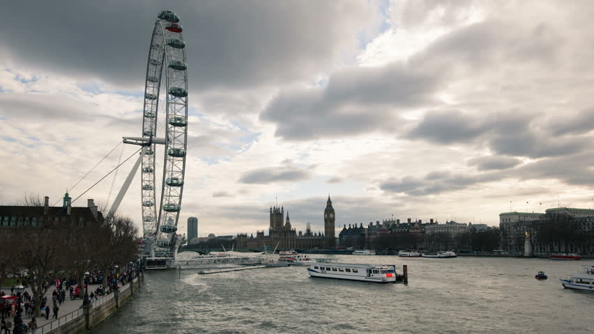LONDON - APRIL 14: London skyline with London Eye and Westminster on Thames river in a cloudy day on April 14, 2013 in London, UK. London Eye is the tallest Ferris wheel in Europe at 135 meters. 