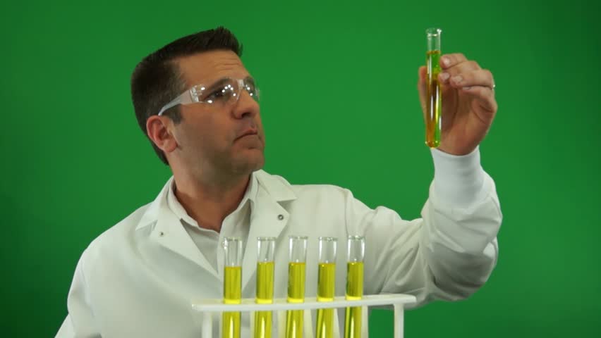 Laboratory Worker Examining Urine Samples on a Green Screen