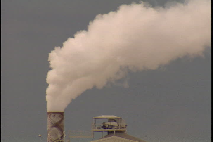 CONVENT, LOUISIANA - CIRCA SEPTEMBER 1999: Thick, white smoke spews from smokestack at Convent oil refinery.