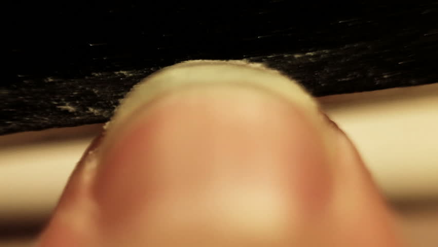 A man grinding nails for better look.