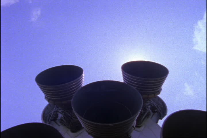 JOHNSON SPACE CENTER, HOUSTON, TEXAS - APRIL 28, 1999: Tilt down from sky to boosters on bottom of retired Saturn rocket.
