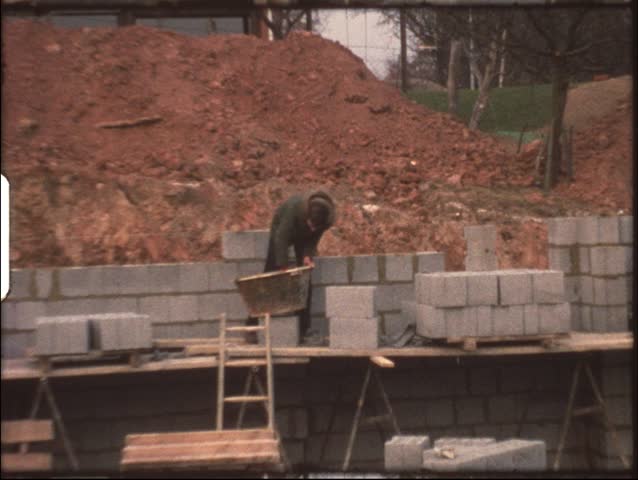 Vintage 8mm film: Housebuilding, Boy laying bricks