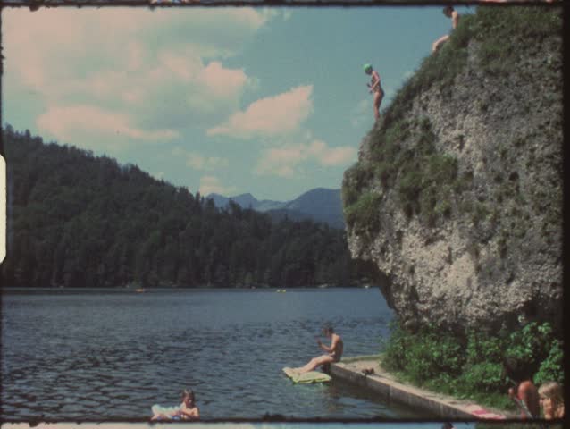 Vintage 8mm film: Children jumping in lake