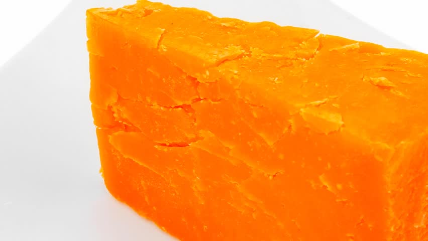 french gourmet dark cheddar cheese served on a ceramic plate 1920x1080 intro motion slow hidef hd