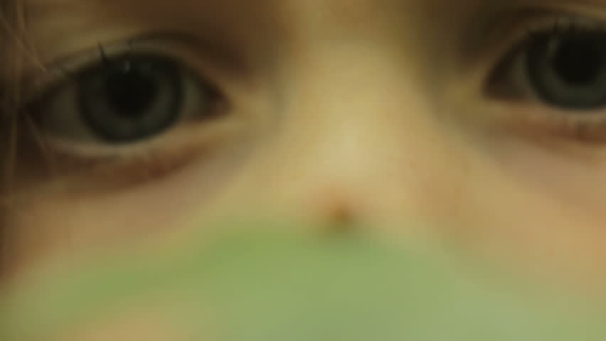 Nature explorer - a child watching a ladybug with a magnifying glass
