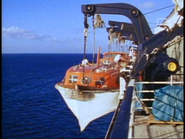 QE2 tenders 1982 World Cruise, lifeboats half lowered on davits