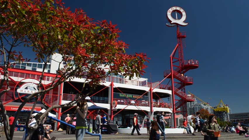 NORTH VANCOUVER, CANADA - MAY 5, 2013: Tourists and locals enjoy the sunshine on Lonsdale Quay. An early heatwave has broken records in southwest British Columbia this spring.