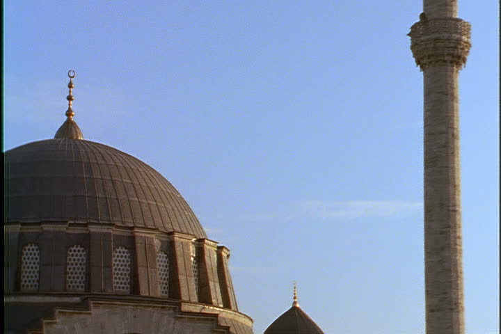 ISTANBUL - CIRCA NOVEMBER 1999: Tilt down from top of minaret to large dome of Mihrimah mosque.