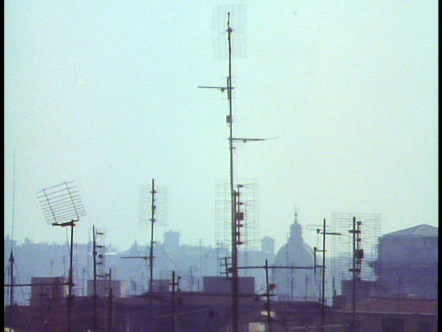 Rome, Italy, Close up of aluminum antennas on roofs, backlighting