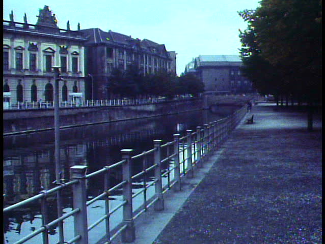 East Berlin, Germany, 1988, wide shot, classical buildings, no people, bleak, canal park