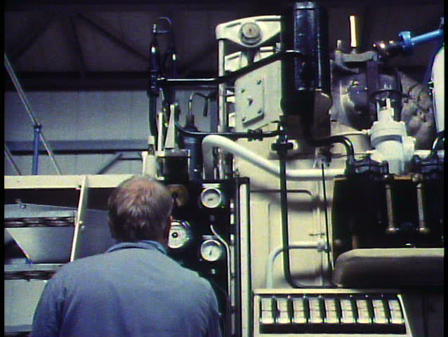 Holland, The Netherlands, Pumping station, modern hydro equipment, medium shot with worker