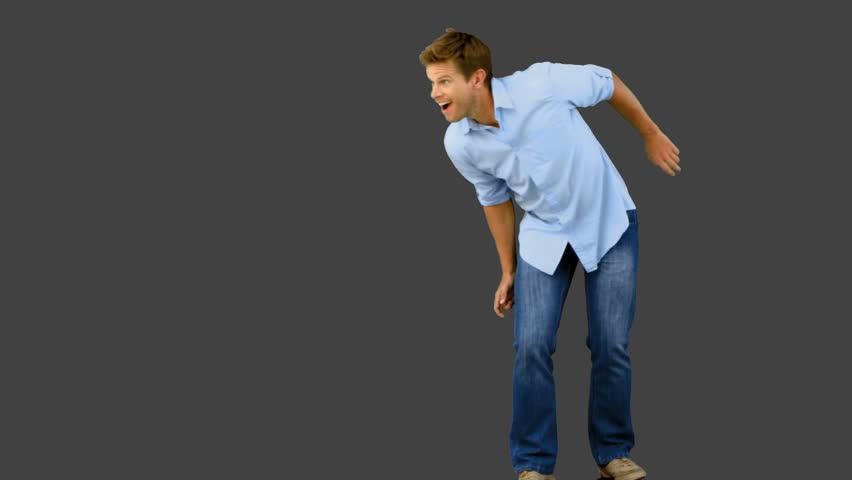 Man skating on grey screen in slow motion