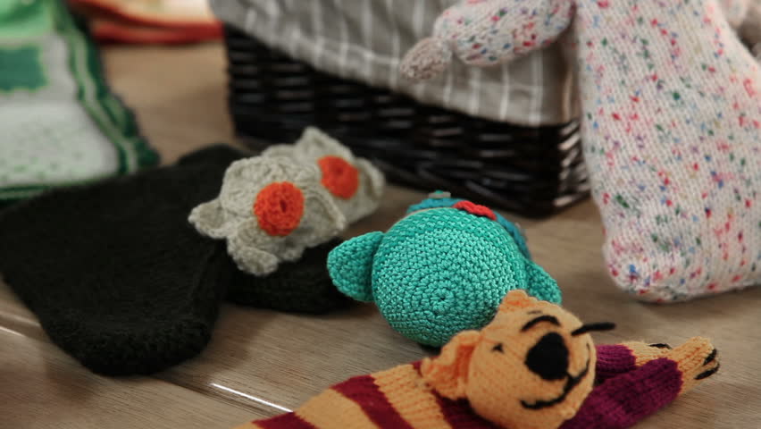 Women learning to knit and showing their art products