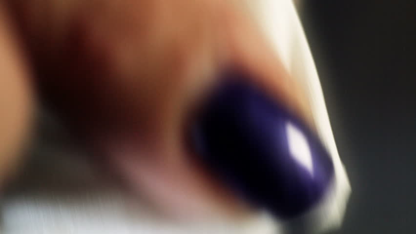 Woman removing the gel like nail polish, after it was soften by gel remover in other related stock video.