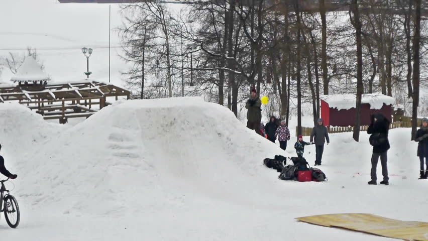 PETROZAVODSK, RUSSIA - FEBRUARY ,16: Biker making jumping tricks during Hyperborea festival on February 16, 2013 in Petrozavodsk, Russia. Event was free for watching and participating, 