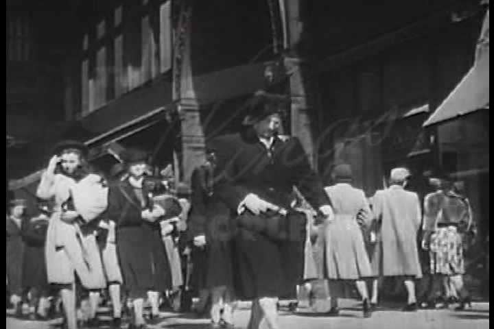 1940s - Good shots of 1940s streets and people buying and selling followed by the boss telling a salesman how to sell his products better.