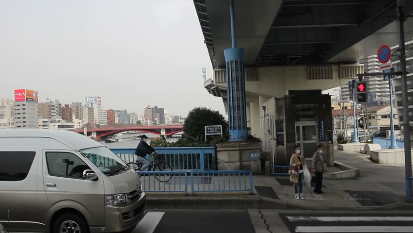 TOKYO - CIRCA MARCH 2013: Driving across the Sumida River in Tokyo.