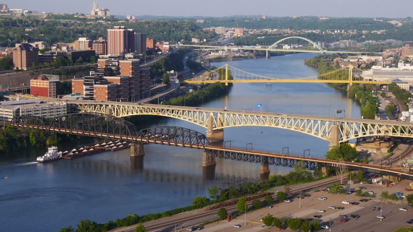 A coal barge travels up the Monongahela River in downtown Pittsburgh, PA.