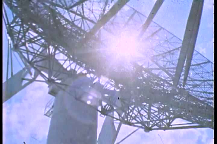 1960s - A satellite dish monitors space communication.