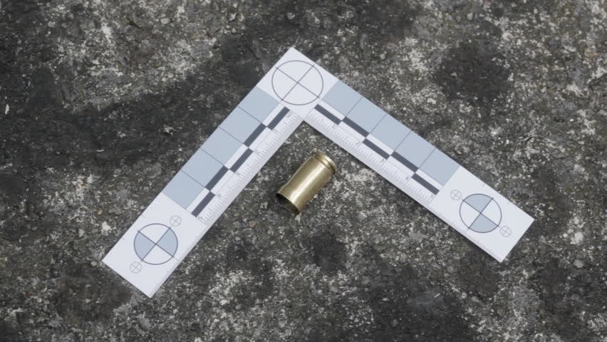 Pan to bullet case and forensic ruler