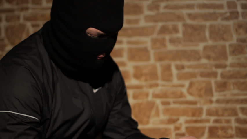 Criminal man loads the gun 
