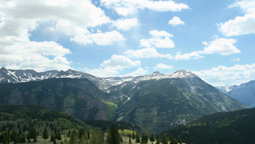 Snow Capped Rocky Mountain Range Time Lapse Pan
