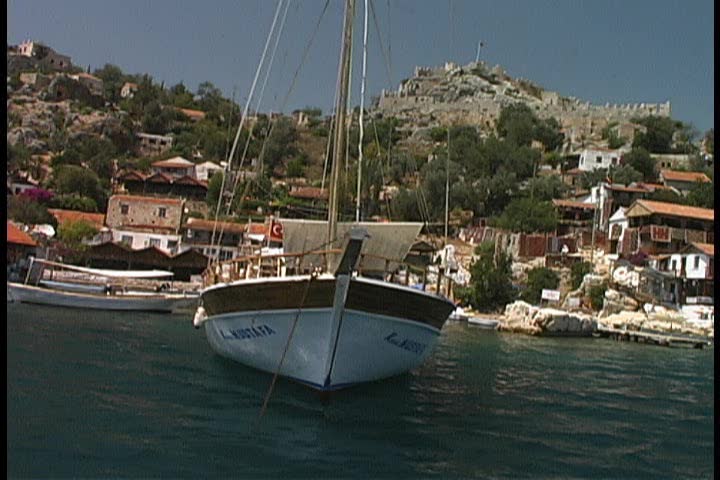 An island harbor with a Byzantine castle at the top