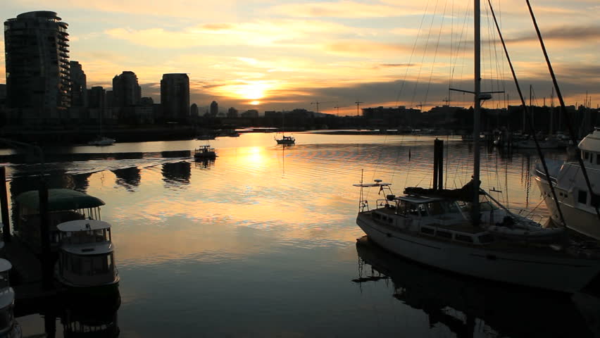 False Creek Morning Boats Passing. Boats pass in the early morning in False Creek. Vancouver, British Columbia, Canada.

