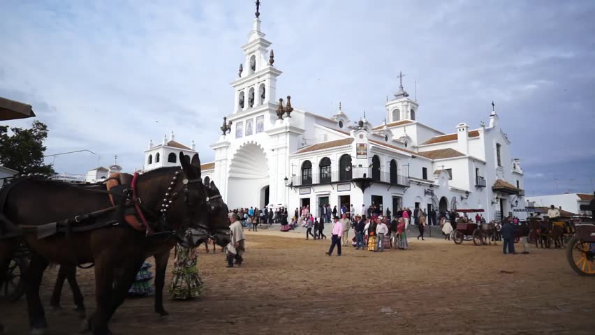 El ROCIO, ANDALUCIA, SPAIN - MAY 19: Pilgrims, people attend to the Sanctuario de Nuestra Senora de El Rocio in one of the most famous religious pilgrimage of Spain. May 19, 2013 in el Rocio, Spain