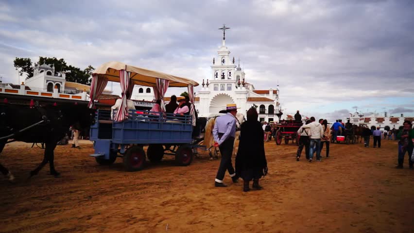El ROCIO, ANDALUCIA, SPAIN - MAY 19: Pilgrims, people attend to the Sanctuario de Nuestra Senora de El Rocio in one of the most famous religious pilgrimage of Spain. May 19, 2013 in el Rocio, Spain