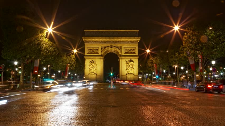 Arch of Triumph at night, Paris, France, Traffic time lapse, one of the monuments of Paris, with Eiffel tower, Louvre, Montmartre, Montparnasse, Moulin Rouge, Versailles, Pompidou Center, Notre Dame.