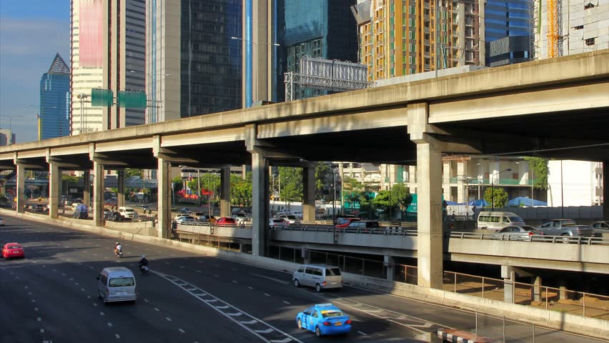 Traffic in the city. There are several freeway lane.