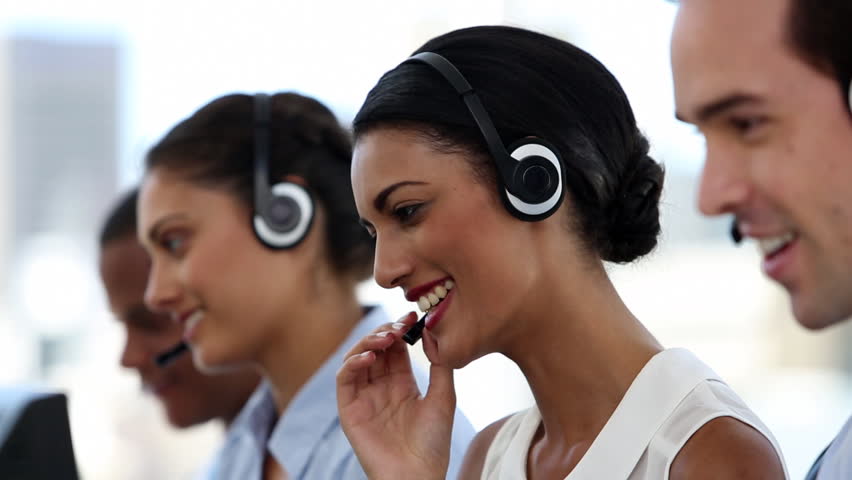 Call centre agents working in their bright office