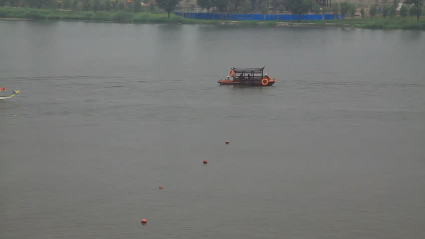 LUANNAN - JUNE 15: The dragon boat race scene in Chinese traditional Dragon Boat Festival on June 15, 2013, Luannan, Hebei Province, China.

