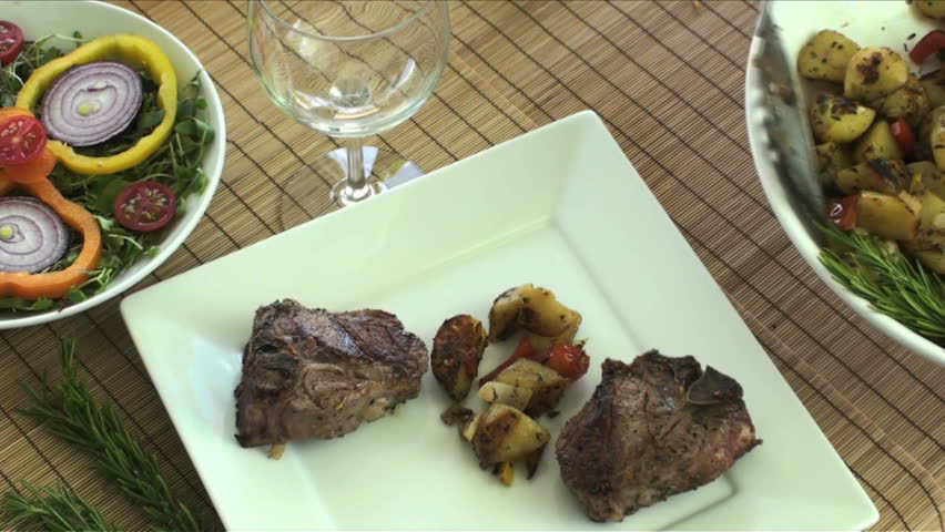 1920x1080 Lamb chops served with potatoes, red peppers and salad. 