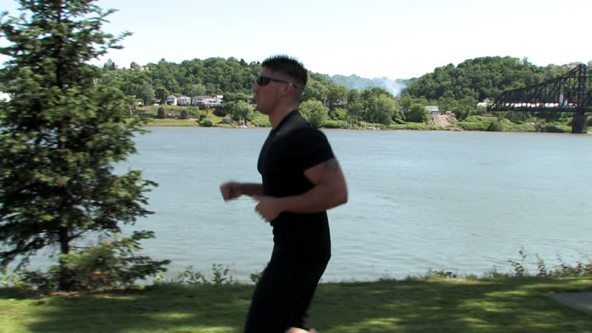 A man jogs in the park.