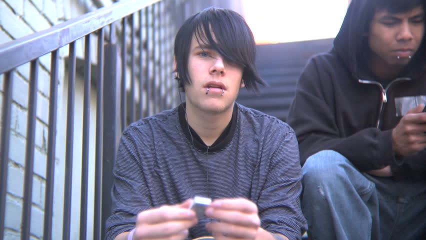 Group of teenage boys sitting on steps