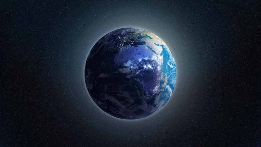 Zoom at rotating Earth with visible city lights at night