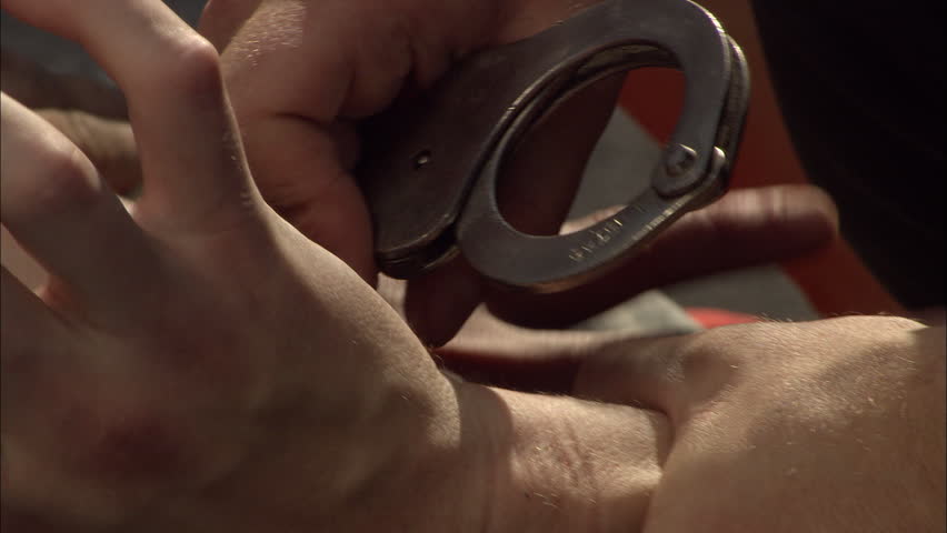 Criminal detention, close of an criminal's hands being handcuffed